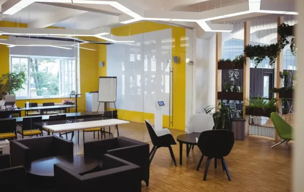 Stylish and productive office space with ergonomic furniture, collaborative areas, and a balanced color scheme reflecting modern office design trends in Kochi and Bengaluru.