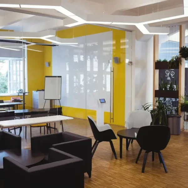 Stylish and productive office space with ergonomic furniture, collaborative areas, and a balanced color scheme reflecting modern office design trends in Kochi and Bengaluru.